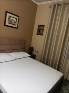 Ένα ή περισσότερα κρεβάτια σε δωμάτιο στο Twins Villa Mangalem