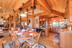a kitchen and dining room with a table and chairs at 1 Mi to Lake Tahoe Home with Hot Tub and Decks in Tahoe City