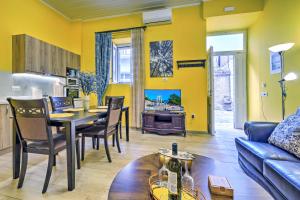 a living room with a table and a couch at Gaia Suite in Nafplio