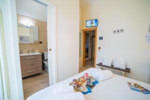 Ένα ή περισσότερα κρεβάτια σε δωμάτιο στο B&B A Due Passi
