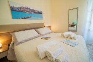 Postel nebo postele na pokoji v ubytování B&B A Due Passi