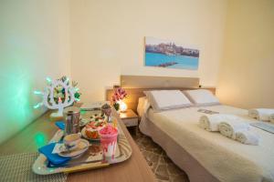 Ένα ή περισσότερα κρεβάτια σε δωμάτιο στο B&B A Due Passi