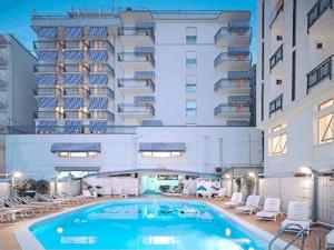 a large swimming pool in front of a hotel at Hotel Marea con Piscina NUOVA GESTIONE in Cattolica