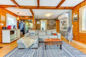 a living room with a couch and a table at Pet-Friendly Wilmington Retreat with Hot Tub! in Wilmington