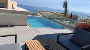 a view of a swimming pool from a house at Green Coast Apartment with Pool in Palasë
