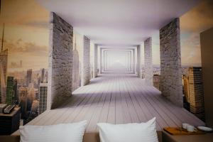Ein Bett oder Betten in einem Zimmer der Unterkunft Chief Hotel