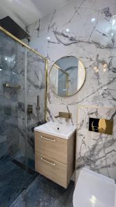 a bathroom with a sink and a mirror at Appartement 3 PIECES NICE Promenade in Nice +29 photos