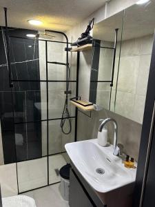 a bathroom with a sink and a shower at Vip Otel in Istanbul