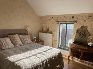 a bedroom with a bed and a large window at Maison Nomade Perche - MaisonNomadeChic in Cour-Maugis-sur-Huisne