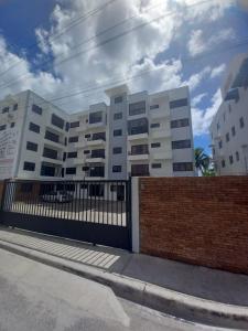 a white building with a fence in front of it at Apartamento con agua caliente para 9 personas in La Ureña +10 photos