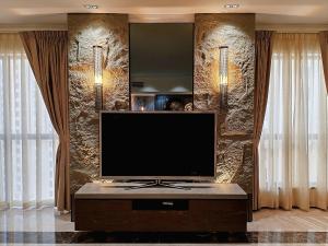 a living room with a flat screen tv on a table at ELAN RIMAL SADAF Suites in Dubai