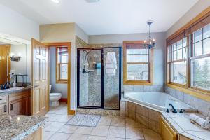 a large bathroom with a tub and a shower at Mountain Sky Retreat in Granby +40 photos
