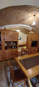 a dining room with a table and chairs and a ceiling at Rodinné apartmány Country golf club Střítež in Třebíč