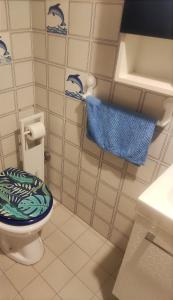 a bathroom with a toilet and a blue towel at Casa mia in Giulianova +41 photos