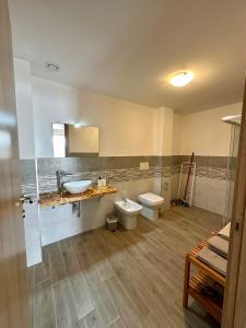a bathroom with a sink and a toilet at Affittacamere Ca' Baldo in Finale Ligure +22 photos