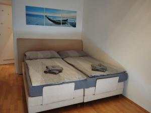 Кровать или кровати в номере Traumapartment neben Universität und Lakeside in Klagenfurt am Wörthersee !