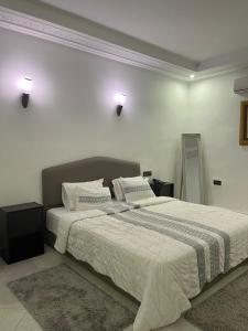 Кровать или кровати в номере Palais Benfatah