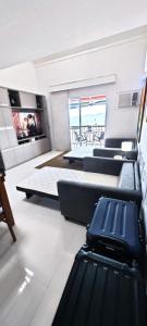 TV a/nebo společenská místnost v ubytování Cobertura frente mar , um andar , na Marina Piratas com estacionamento gratuito