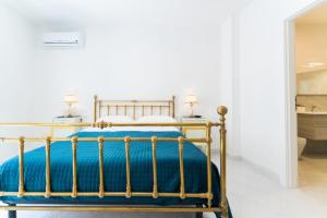 Postel nebo postele na pokoji v ubytování La Corte di Colombo