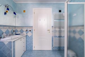 a bathroom with a sink and a mirror at "Il Vicolo" Sunny Lake Garda Villa in Toscolano Maderno +58 photos