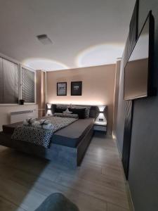 a bedroom with two beds in a room at NOA Luxury Apartment in Bitola