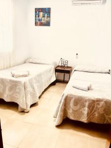 Ένα ή περισσότερα κρεβάτια σε δωμάτιο στο LA CASITA DE BAUTISTA 2 llaves montanchez -caceres