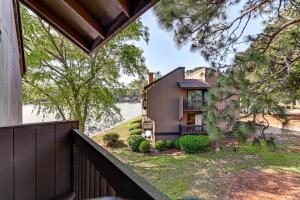 a house with a view of the water at Lakeview Condo with Resort Pool 2 Miles to Golf! in Pinehurst
