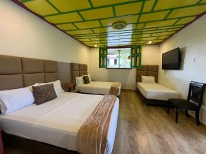 Postel nebo postele na pokoji v ubytování Dreams Hotel y Restaurante