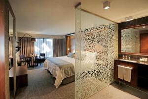 Katil atau katil-katil dalam bilik di Hotel Cumbres Lastarria