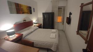 Ένα ή περισσότερα κρεβάτια σε δωμάτιο στο Apartment & Rooms Constantí