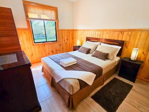 a bedroom with a large bed and a window at Lodge Ancar Atacama in San Pedro de Atacama +127 photos