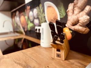 a knife block sitting on top of a table at Cologne LUXE Living: Opulent Elegance Unleashed in Cologne