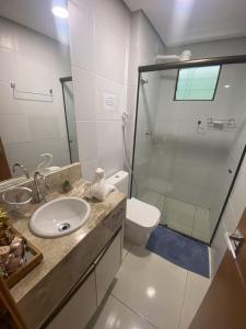 a bathroom with a shower and a sink and a toilet at Apt Alto da Serra Villas - Bananeiras in Bananeiras