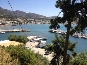 a view of a harbor with boats in the water at Spacious Apartment Garden View Partial Seaview in Makry Gialos +14 photos
