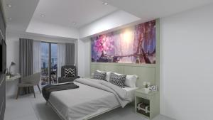 Postel nebo postele na pokoji v ubytování Nemuru Grand Suites + 37 fotografií