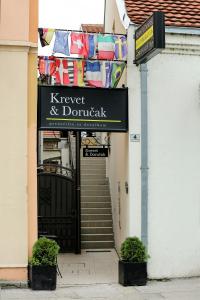 a sign that reads kreyer and durkat on a building at Garni Hotel Krevet&Dorucak in Niš