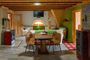 a living room with a table and a couch at Wohlfühl-Villa in Themar in Themar