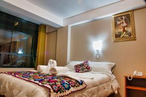 Letto o letti in una camera di Hotel Joram