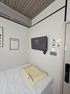 Postel nebo postele na pokoji v ubytování 榆迪賓館 YUTIK Guesthouse