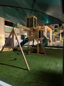 a play set in a tent with a playground at Departamento en Mazatlán in Mazatlán