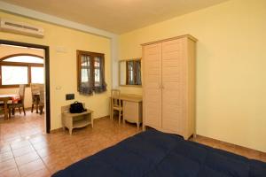 Ένα ή περισσότερα κρεβάτια σε δωμάτιο στο Il Gelso Bianco