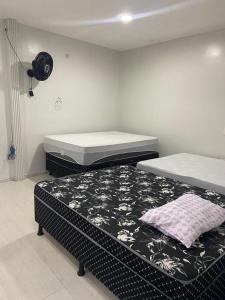 Ένα ή περισσότερα κρεβάτια σε δωμάτιο στο Casa perto do Centro