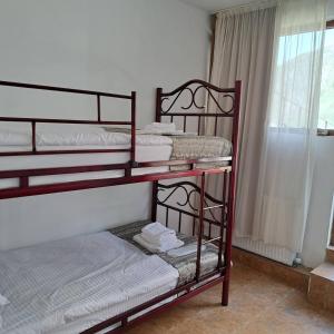 Rúm í herbergi á mood hotel kazbegi garden