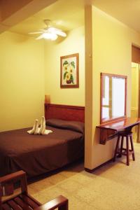 Hotel Florida Oaxaca tesisinde bir odada yatak veya yataklar