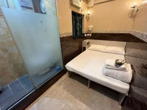 Voodi või voodid majutusasutuse 3D Inn Hong Kong Romance toas