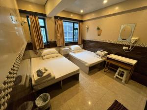 Voodi või voodid majutusasutuse 3D Inn Hong Kong Romance toas