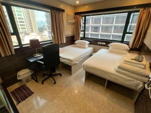 Voodi või voodid majutusasutuse 3D Inn Hong Kong Romance toas