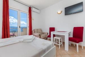 Postel nebo postele na pokoji v ubytování Sita Apartmani