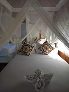 Bintang Tiga Bungalows Gili Air客房内的一张或多张床位