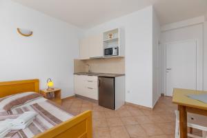 Kuchyň nebo kuchyňský kout v ubytování Sita Apartmani